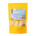 A yellow stand-up pouch of Root+Spring Huang Qi Astragalus raw herbs, featuring a light blue label with product details and a clear window showing the dried herb pieces inside.