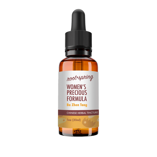 A 1 oz amber glass dropper bottle of Root+Spring Women's Precious Formula (Ba Zhen Tang) Chinese Herbal Tincture, featuring a white label with brown and yellow text, set against a plain white background.